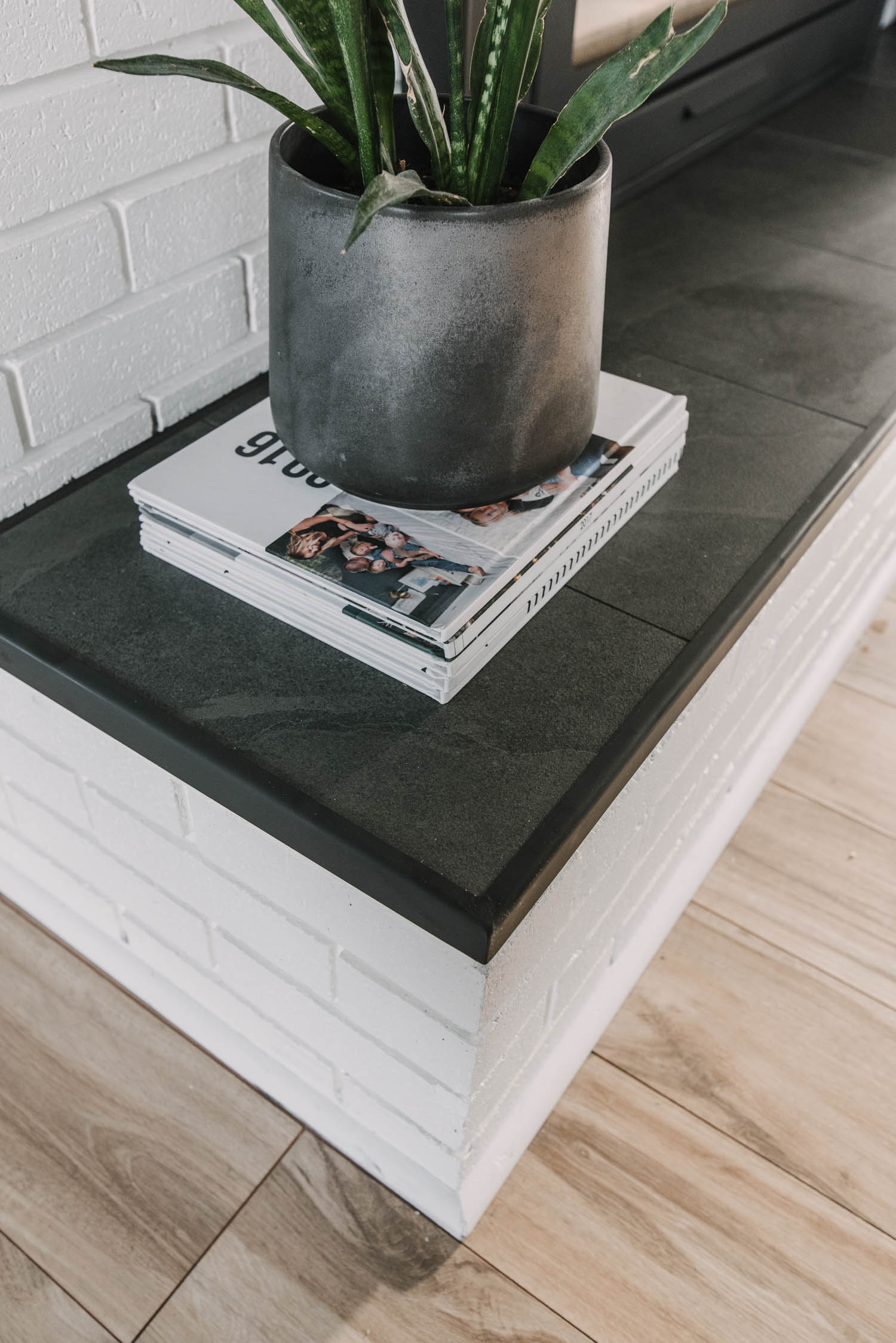custom metal edge for tiled hearth