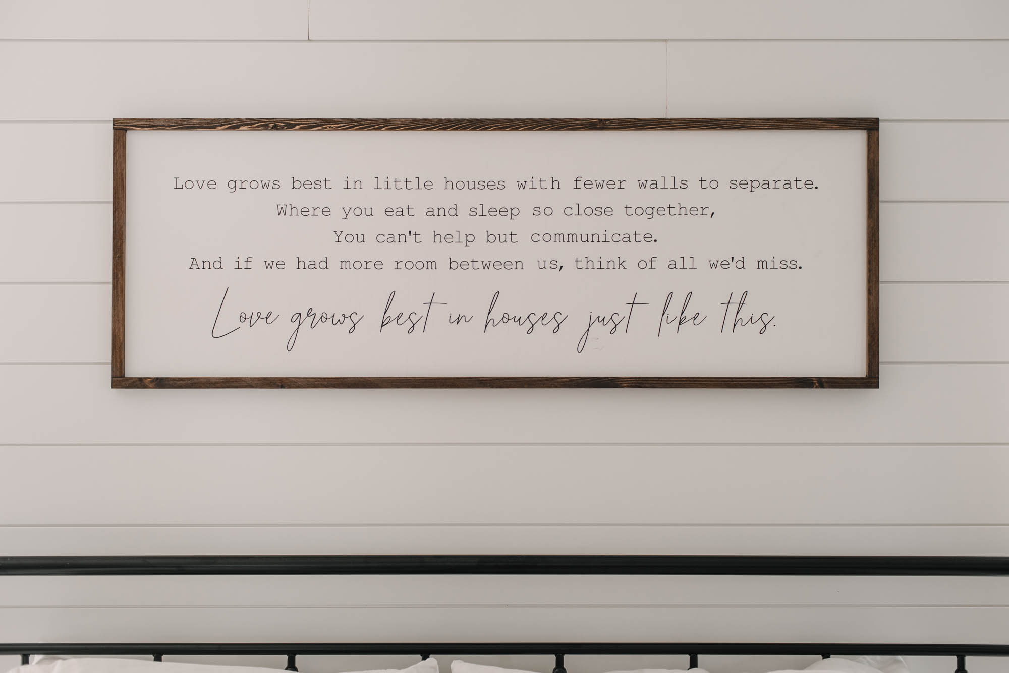 Farmhouse bedroom decor with wooden sign: love grows best in little houses
