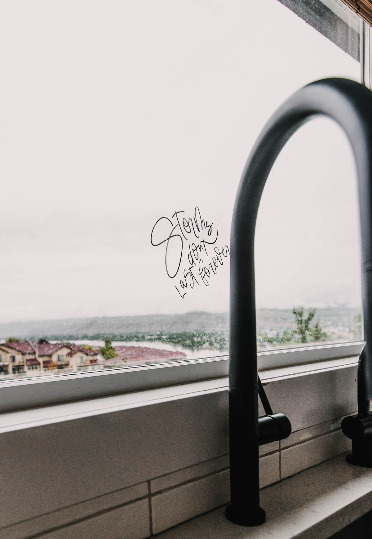 Handlettered reminder on the kitchen window
