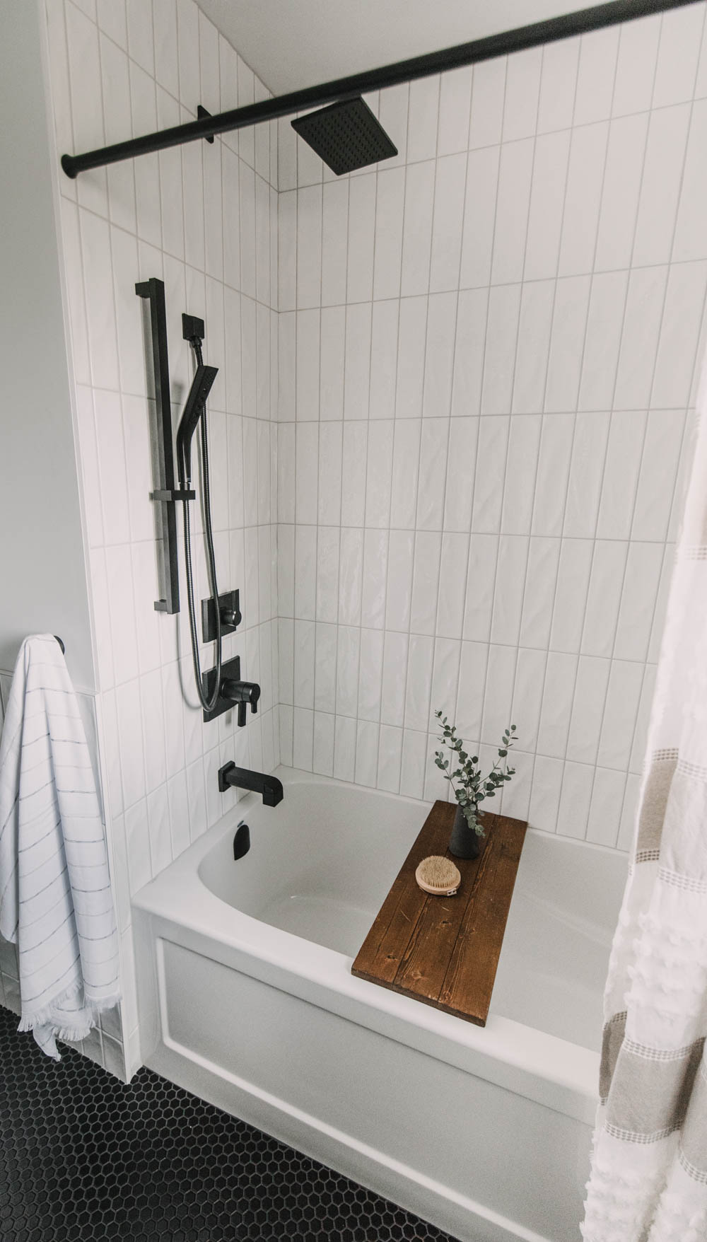 Modern black fixtures for a tub shower combo