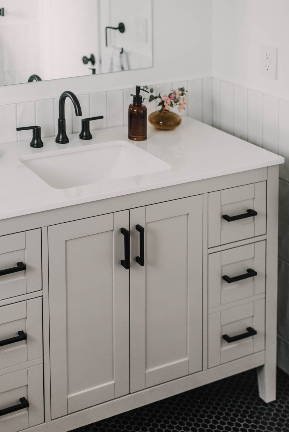 Greige painted vanity with black hardware