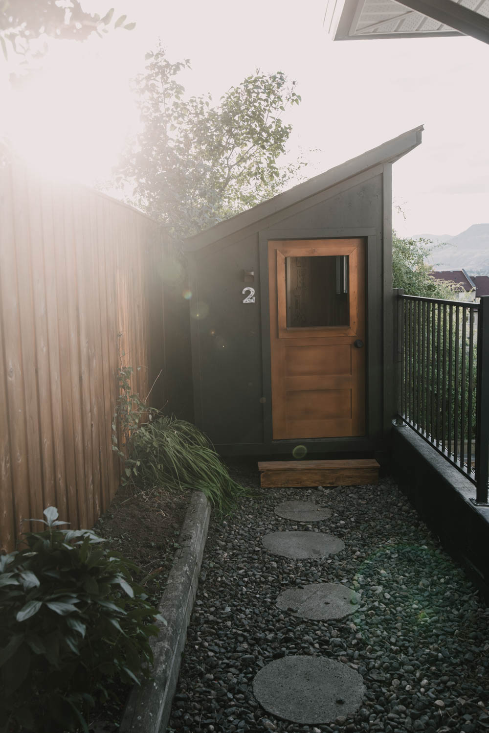 Modern single pitch playhouse with wooden door 