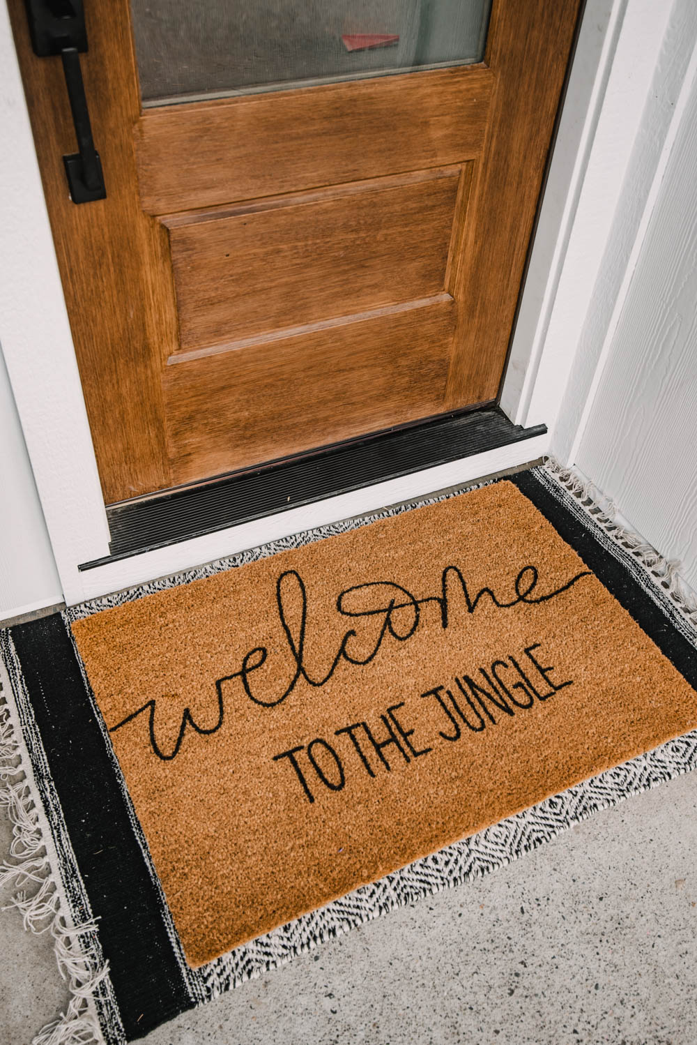 DIY Door Mat reads welcome to the jungle