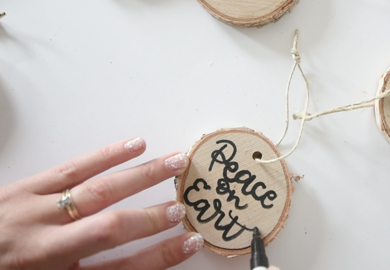 Hand lettered tree slice ornaments