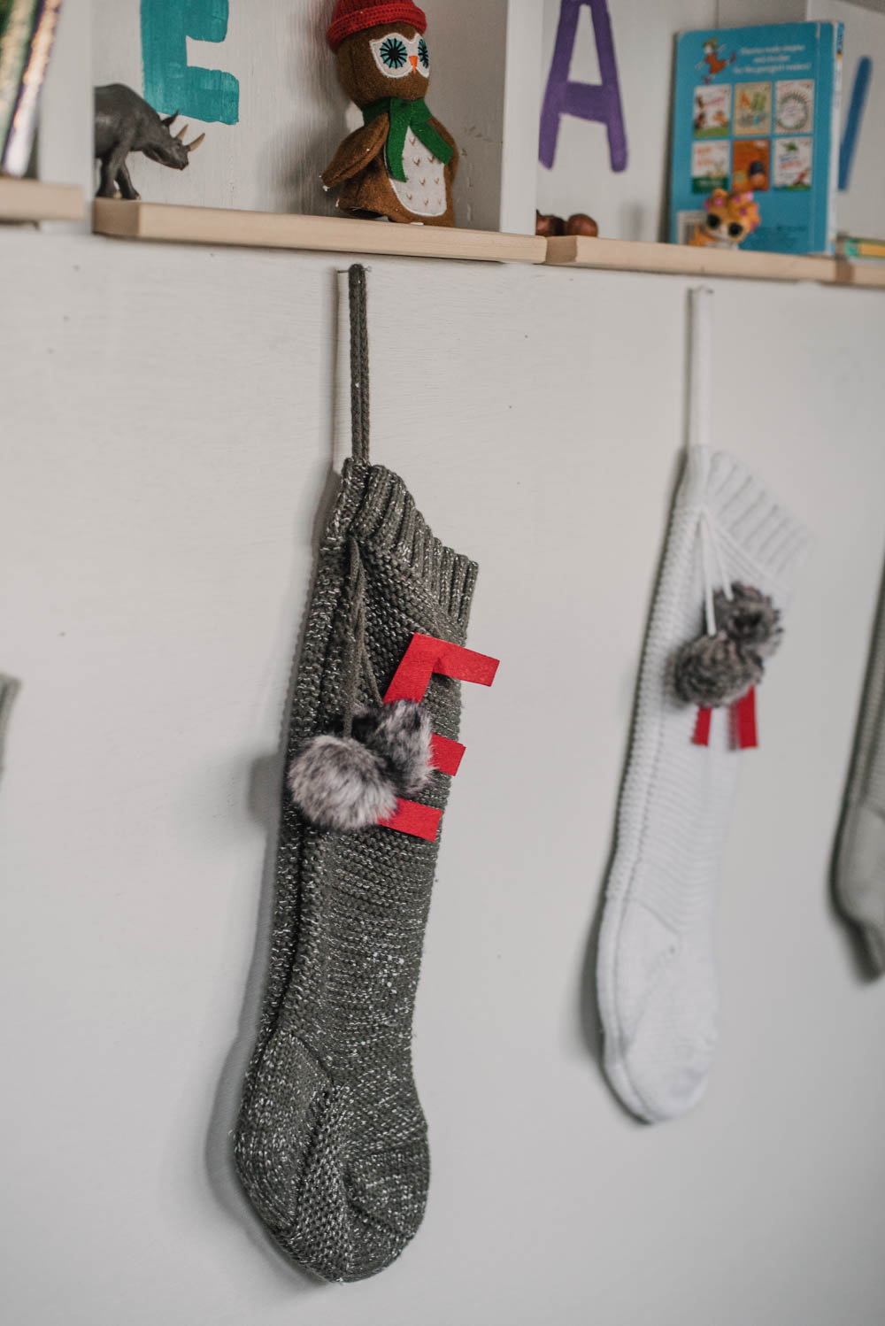 Felt letters on knit stockings
