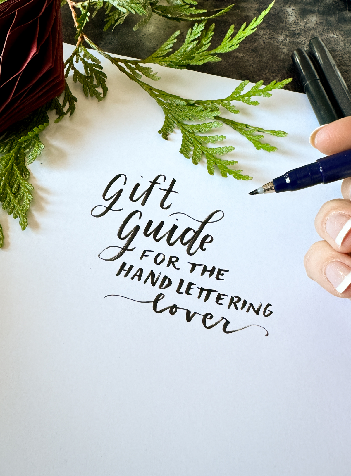 gift guide for hand lettering lovers written on paper in tombow fude pen with holiday accents