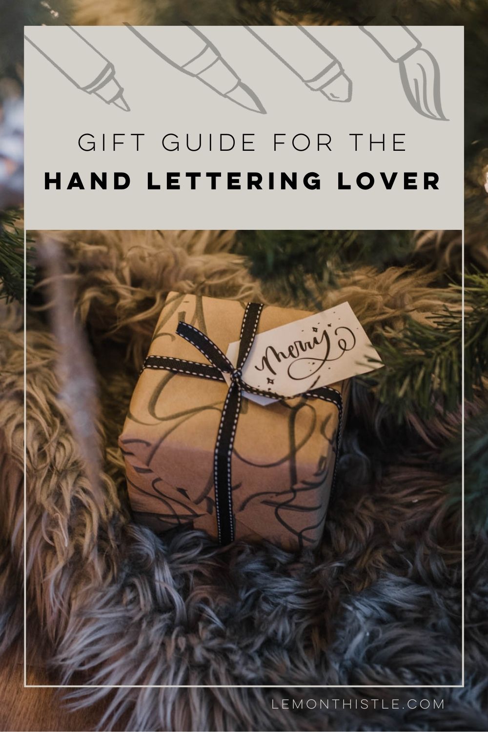 hand lettering gift guide- image of wrapped gift under tree with hand lettered wrapping paper