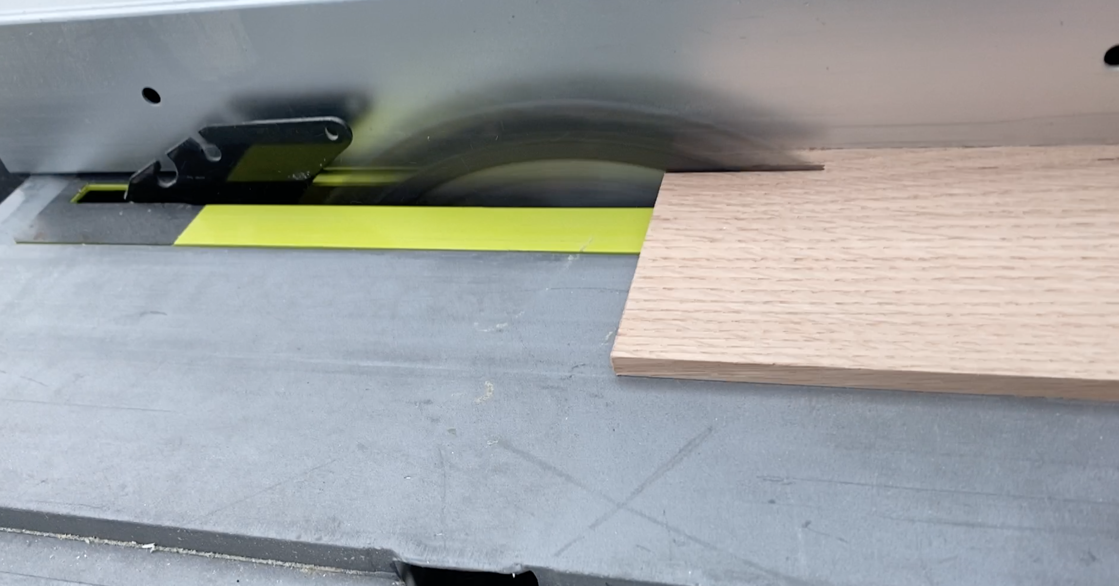 Cut board to size on a table saw