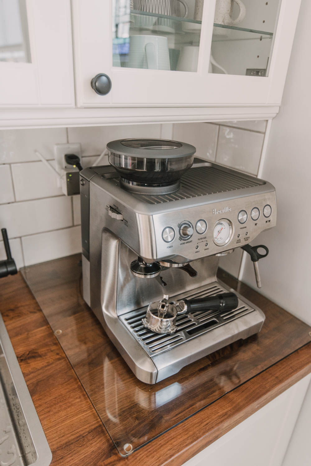 glass cutting board underneath espresso machine for butcher block counters