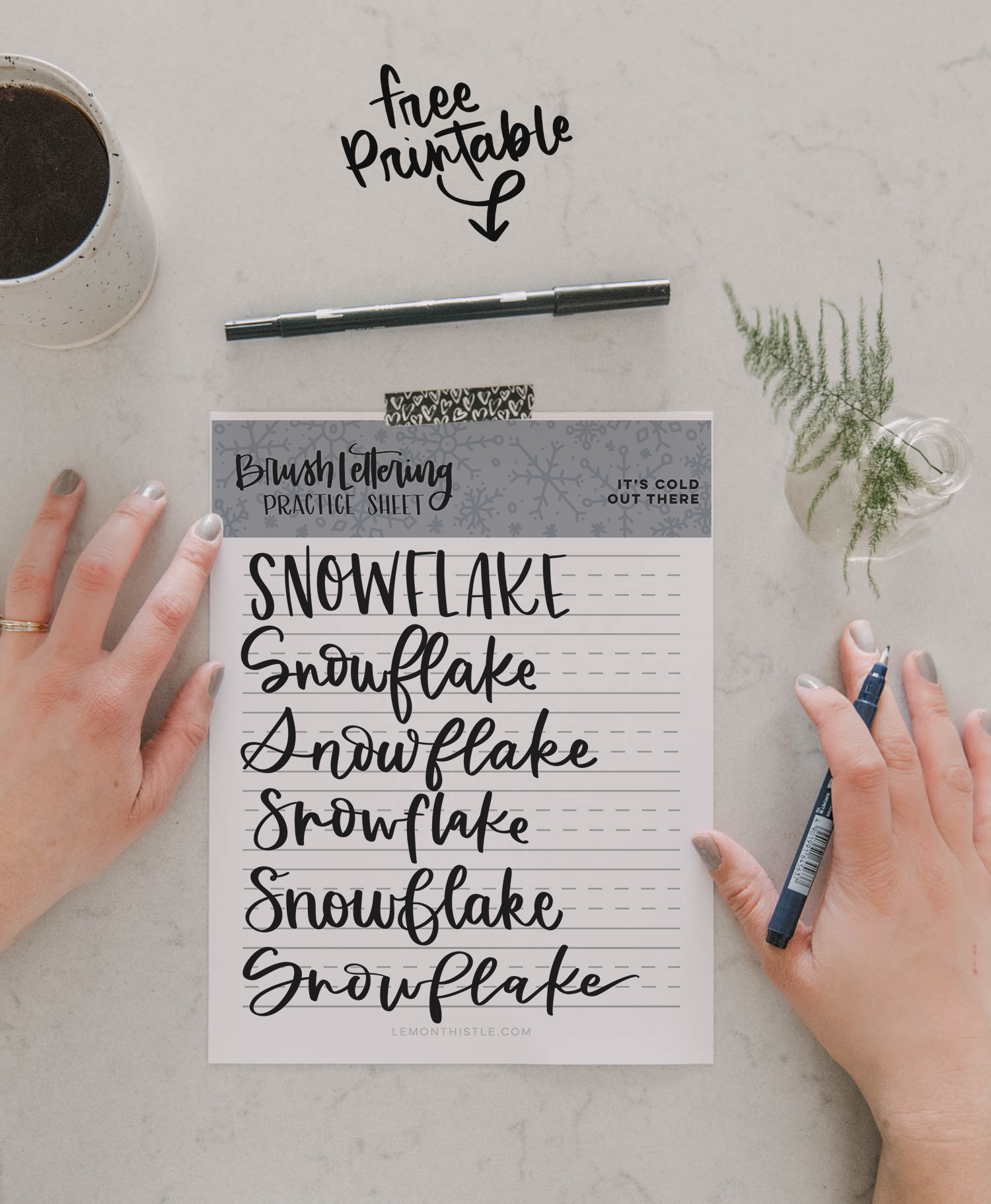 printed snowflake brush lettering practice page with text overlay: Free Printable Practice Sheet