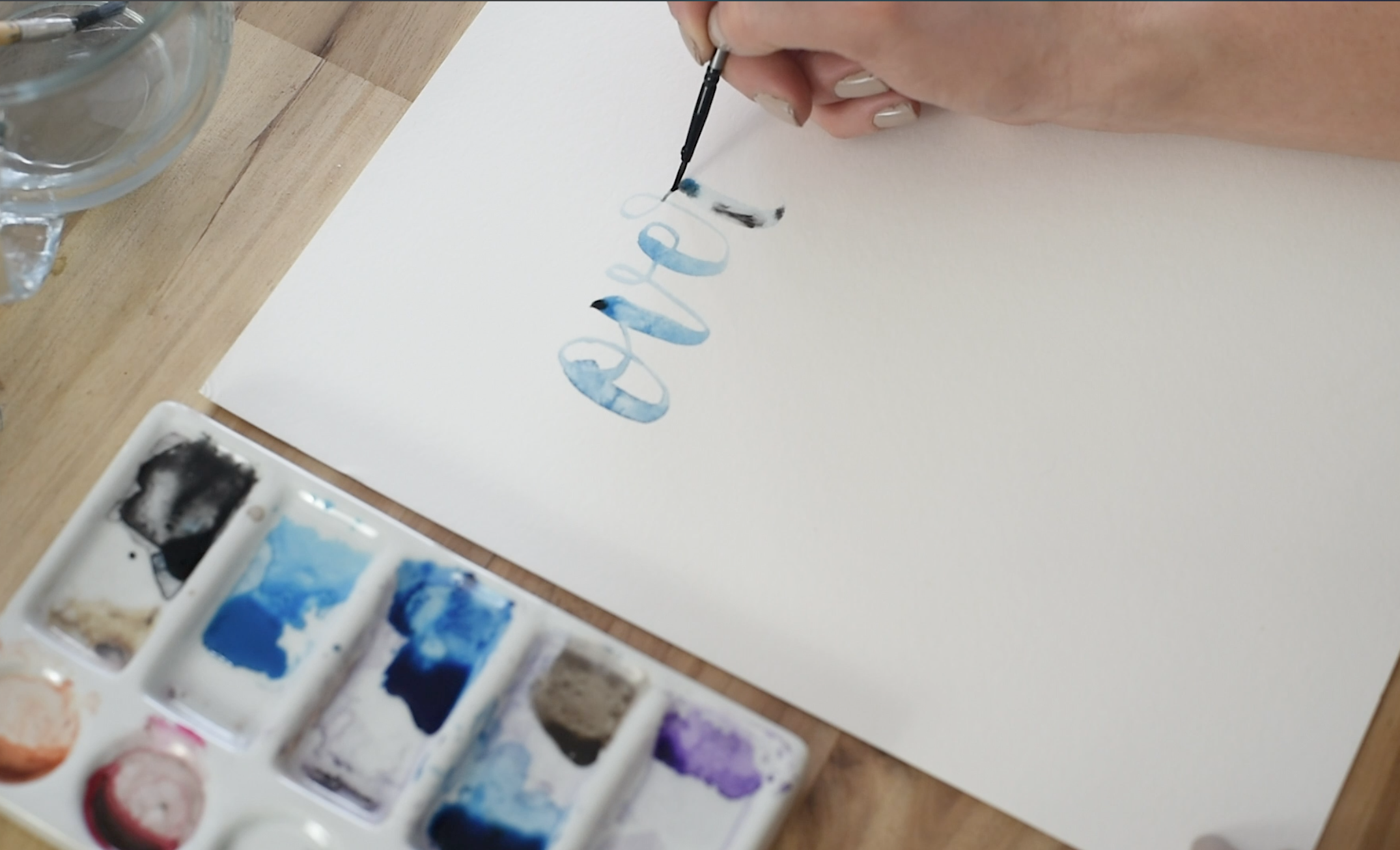 blending black and blue in hand lettering using water