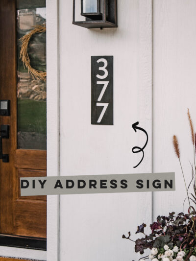 black modern address sign on white house with text overlay: DIY Address Sign