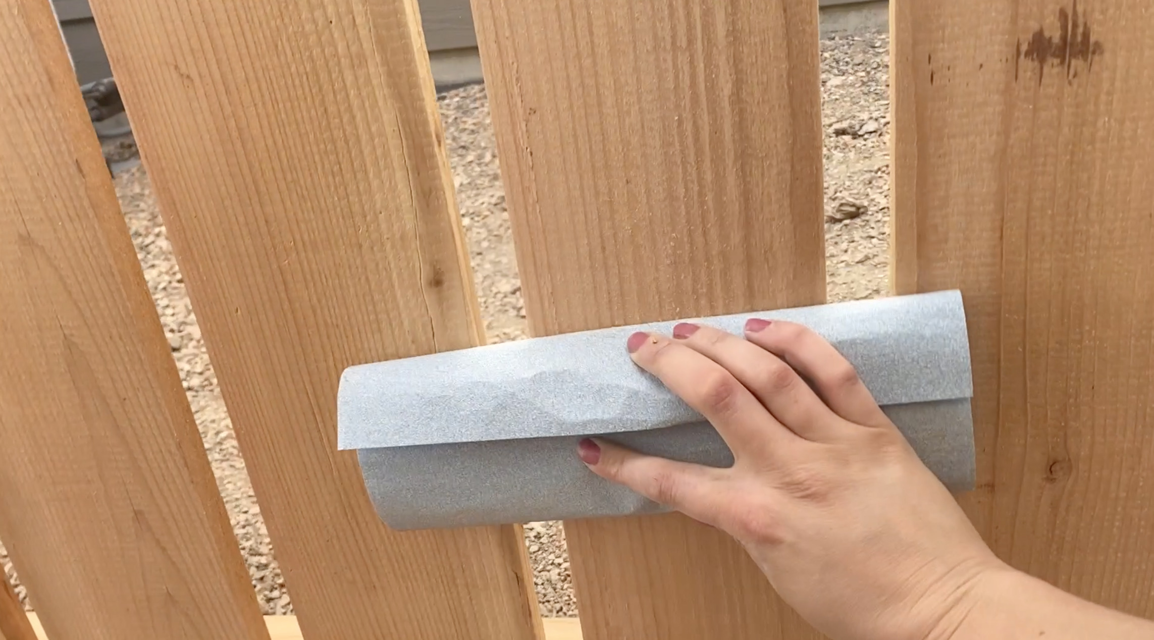 sanding a fence