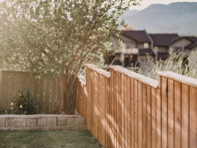 Staining a fence with a paint sprayer