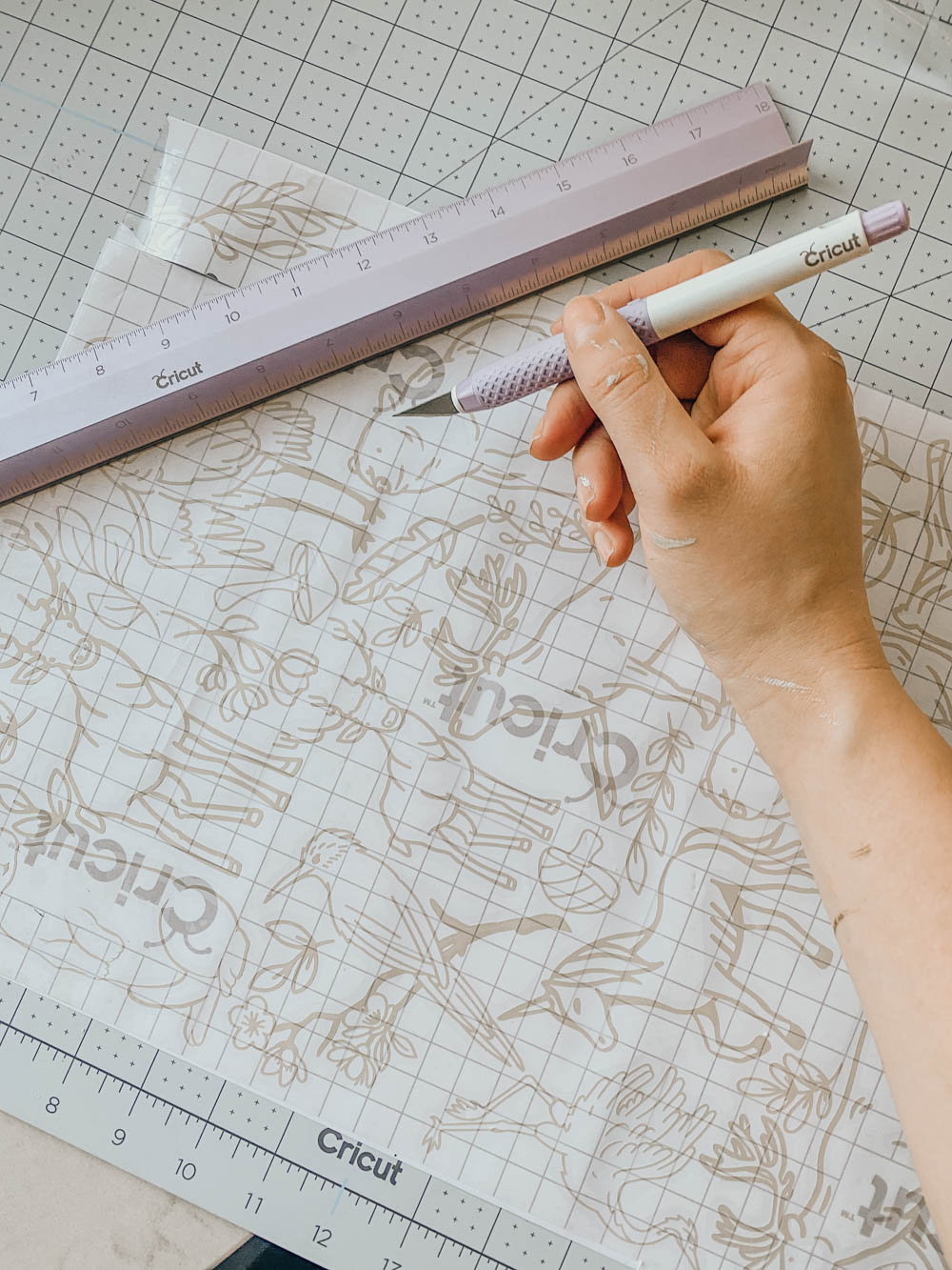 Apply transfer tape before cutting designs apart to save material