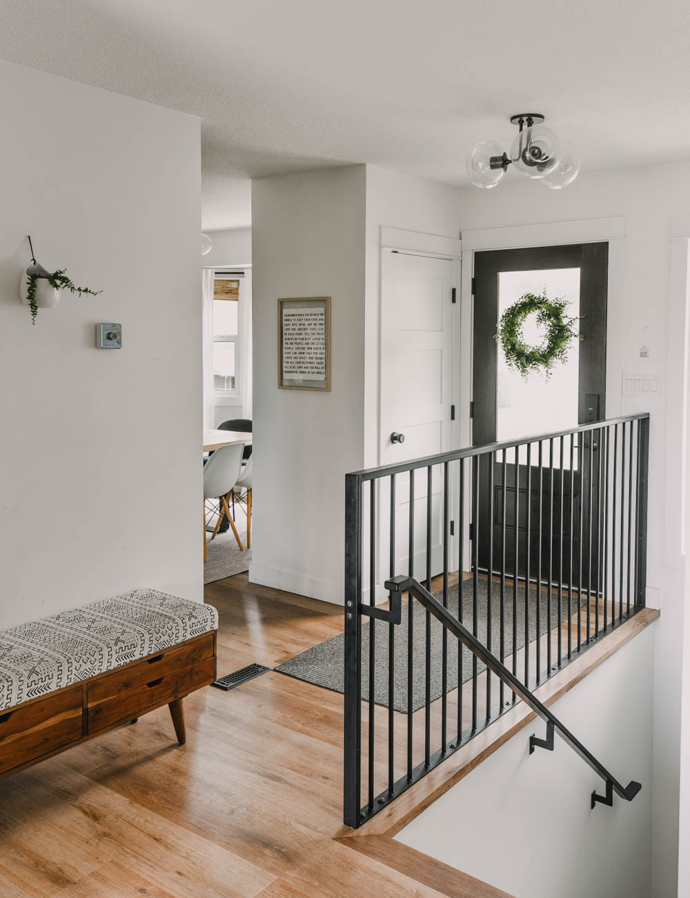 Bright, light entryway decor with modern accents