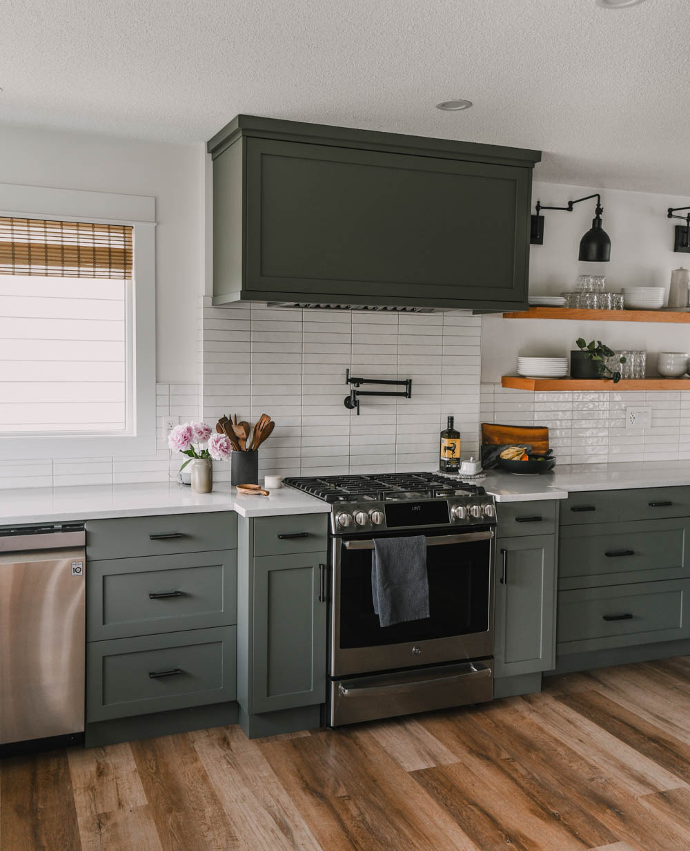 classic green shaker cabinets with white walls