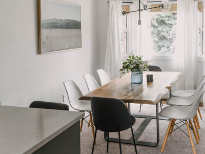 White dining room with cozy accents