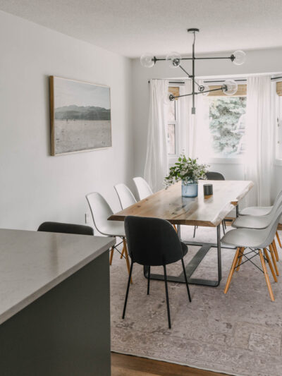 White dining room with cozy accents