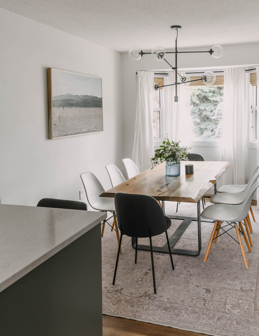 White dining room with cozy accents