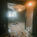 Painting a moulding wall with a paint sprayer