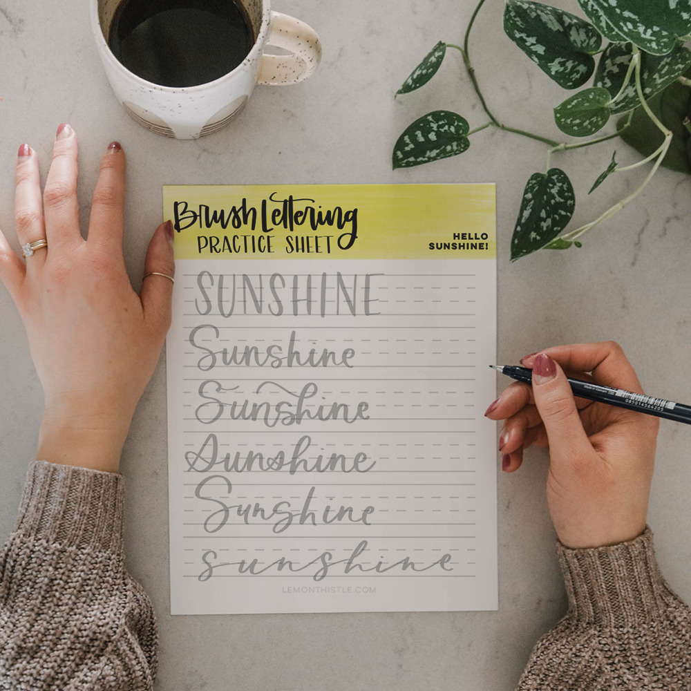hand lettering printable practice sheet in 6 casual hand lettering styles, using the word sunshine
