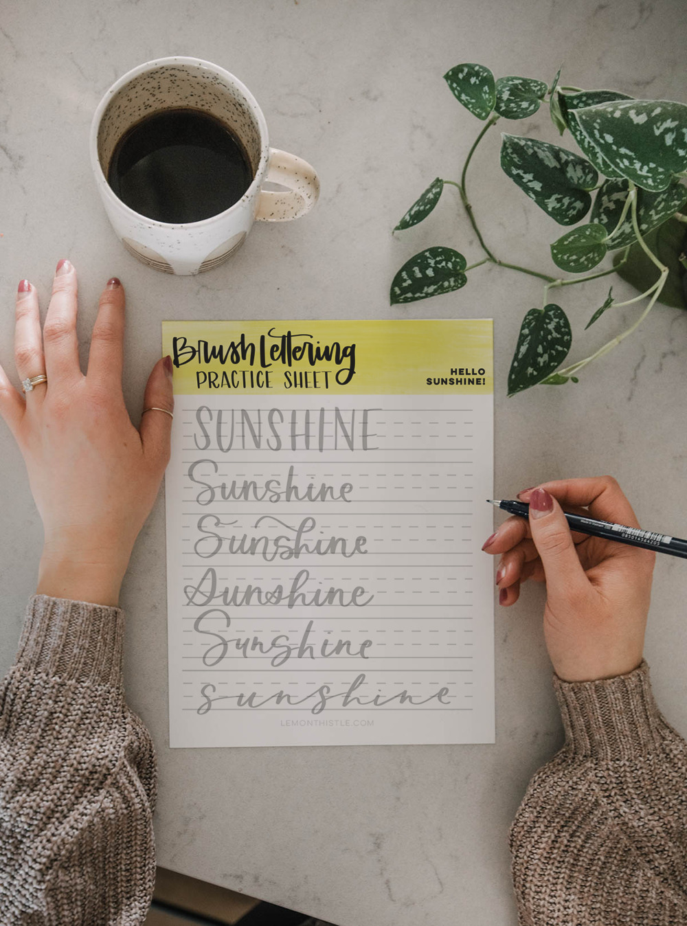 hand lettering printable practice sheet in 6 casual hand lettering styles, using the word sunshine