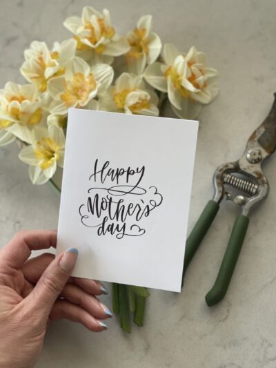 Hand lettered mothers day card with daffodils