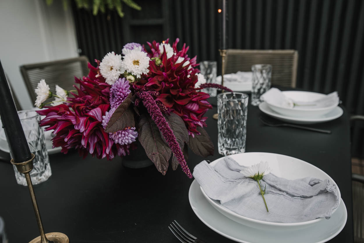late summer garden flowers in an outdoor tablescape centrepiece