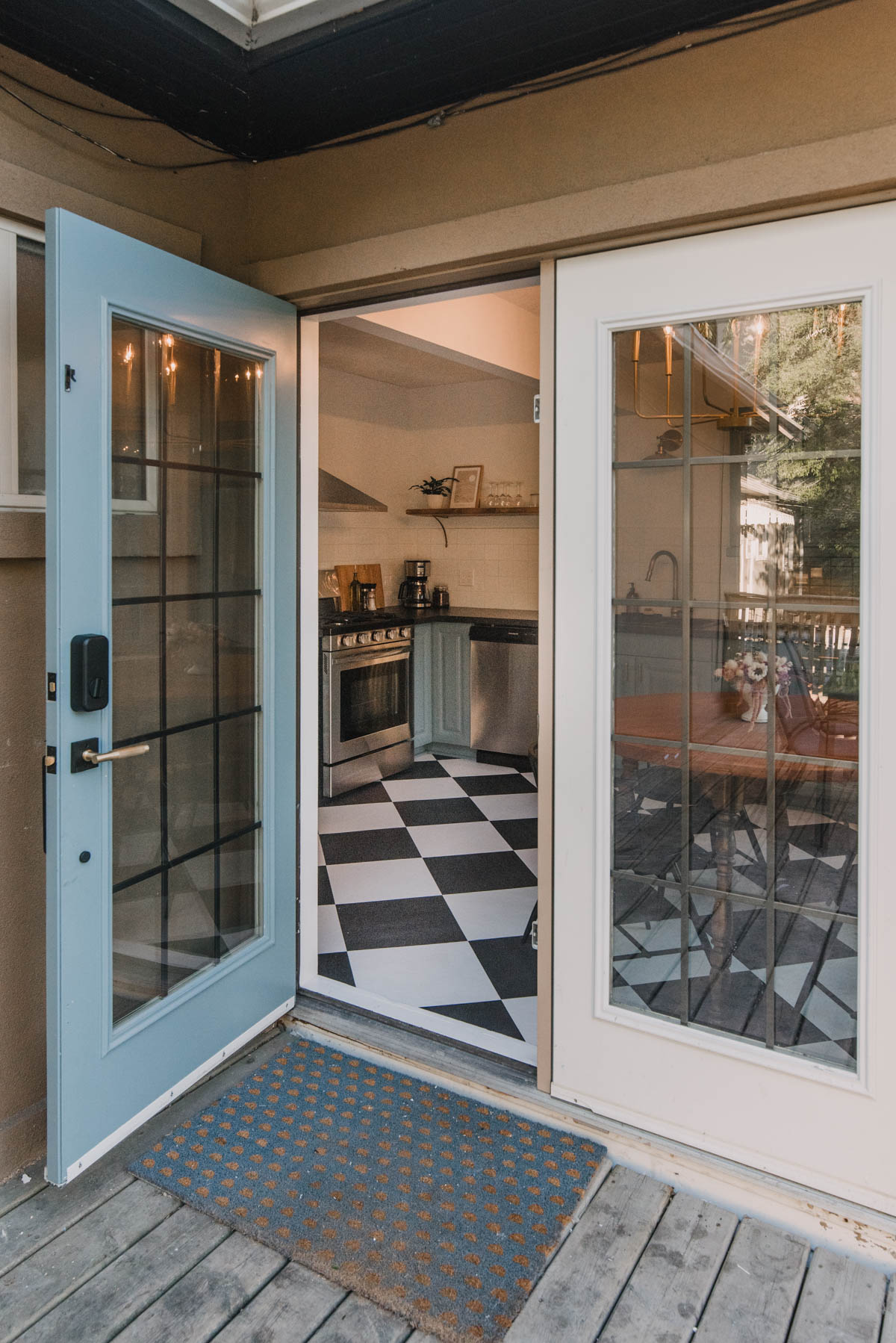 French doors into a blue kitchen