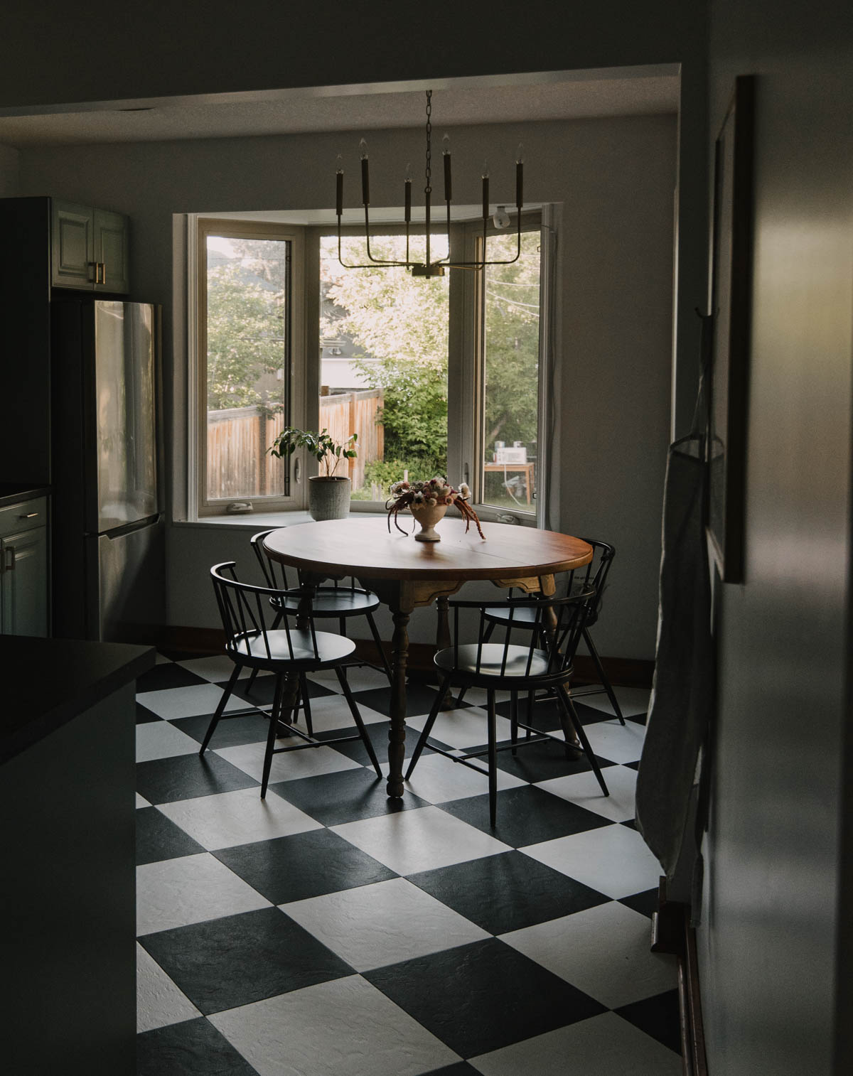 Checkerboard floor in a blue kitchen