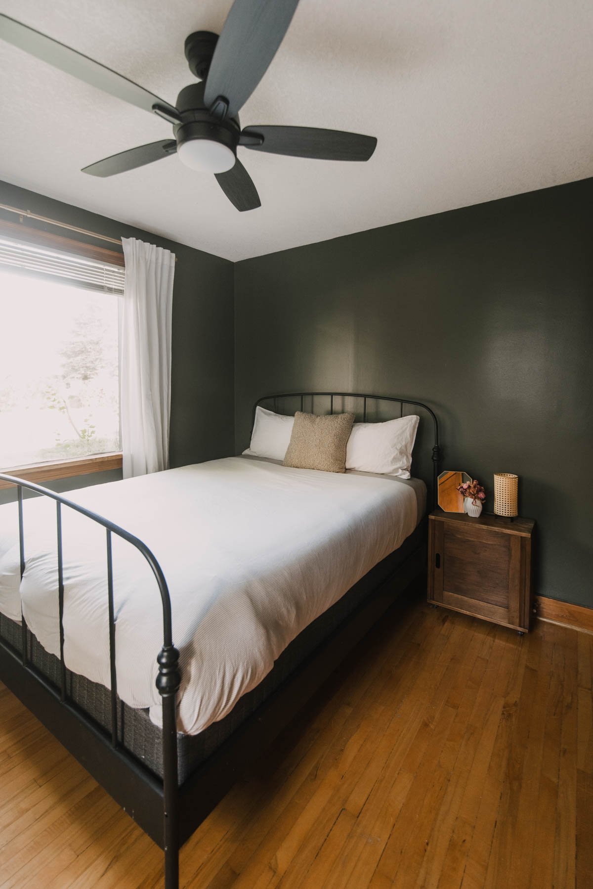 Cozy Green bedroom with wood trim