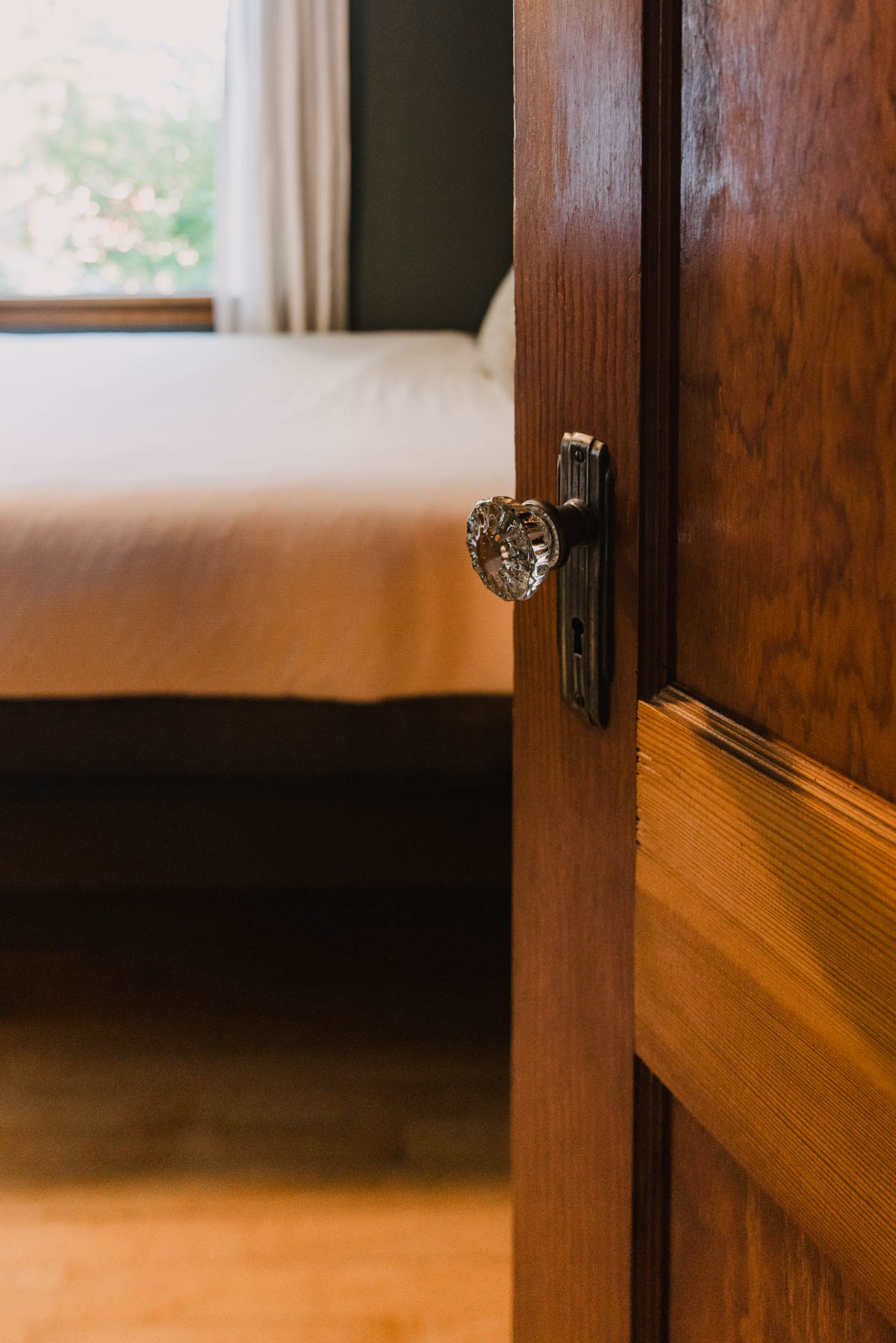 Forest Floor Green Bedroom makeover with dark wood doors