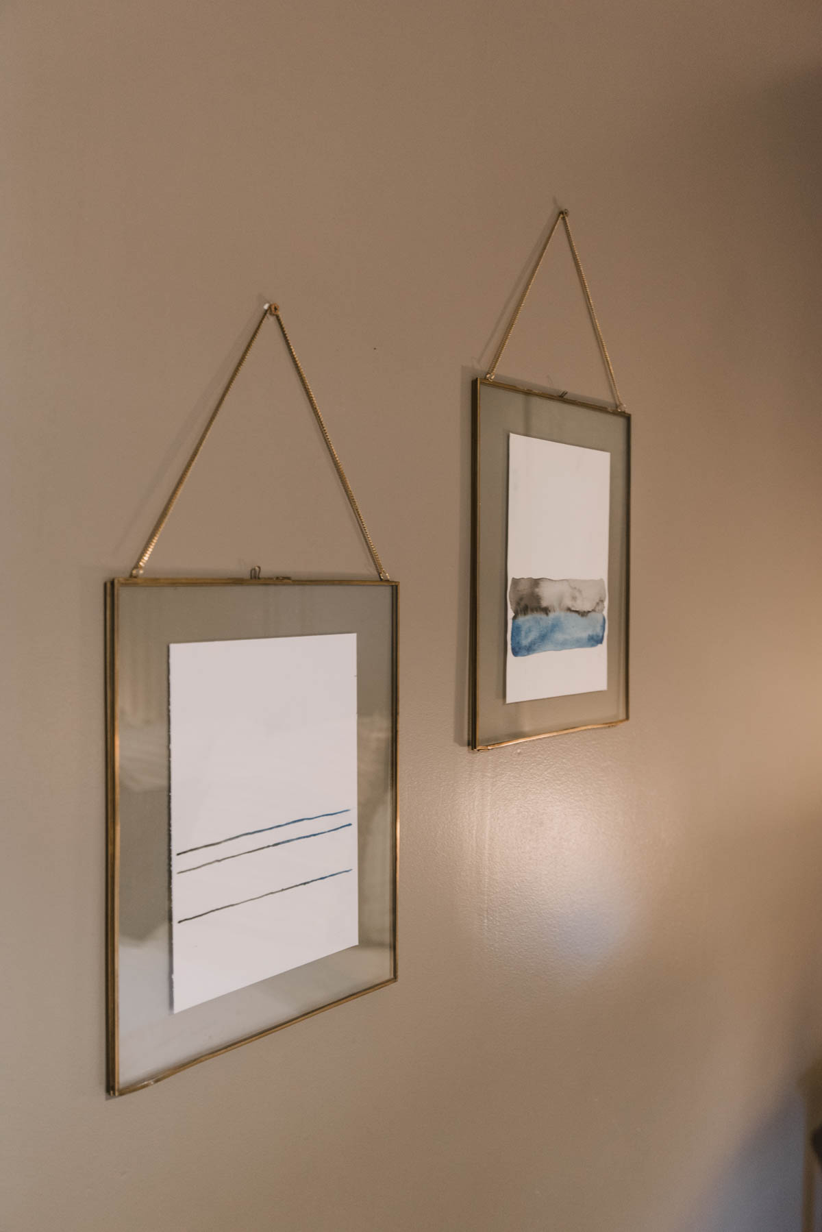 Simple watercolour artwork in brown bedroom