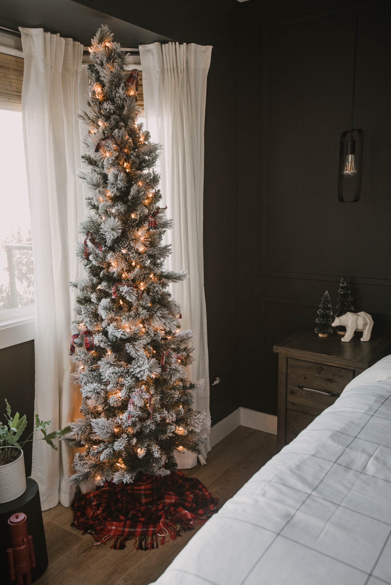 Skinny flocked tree with plaid ribbon decor