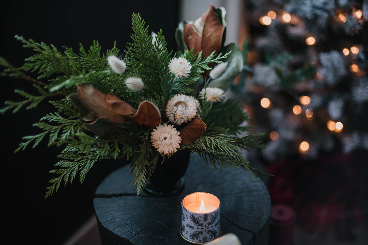 Holiday greenery arrangement with dried florals