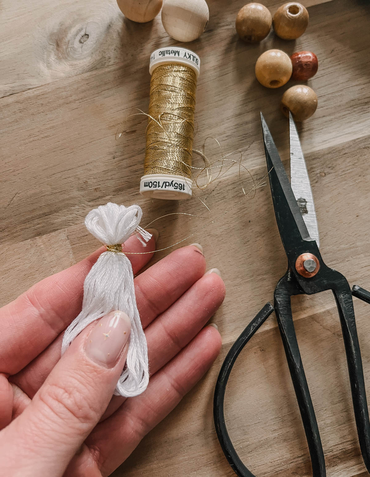 making a tassel with dollar store embroidery thread for a DIY ornament