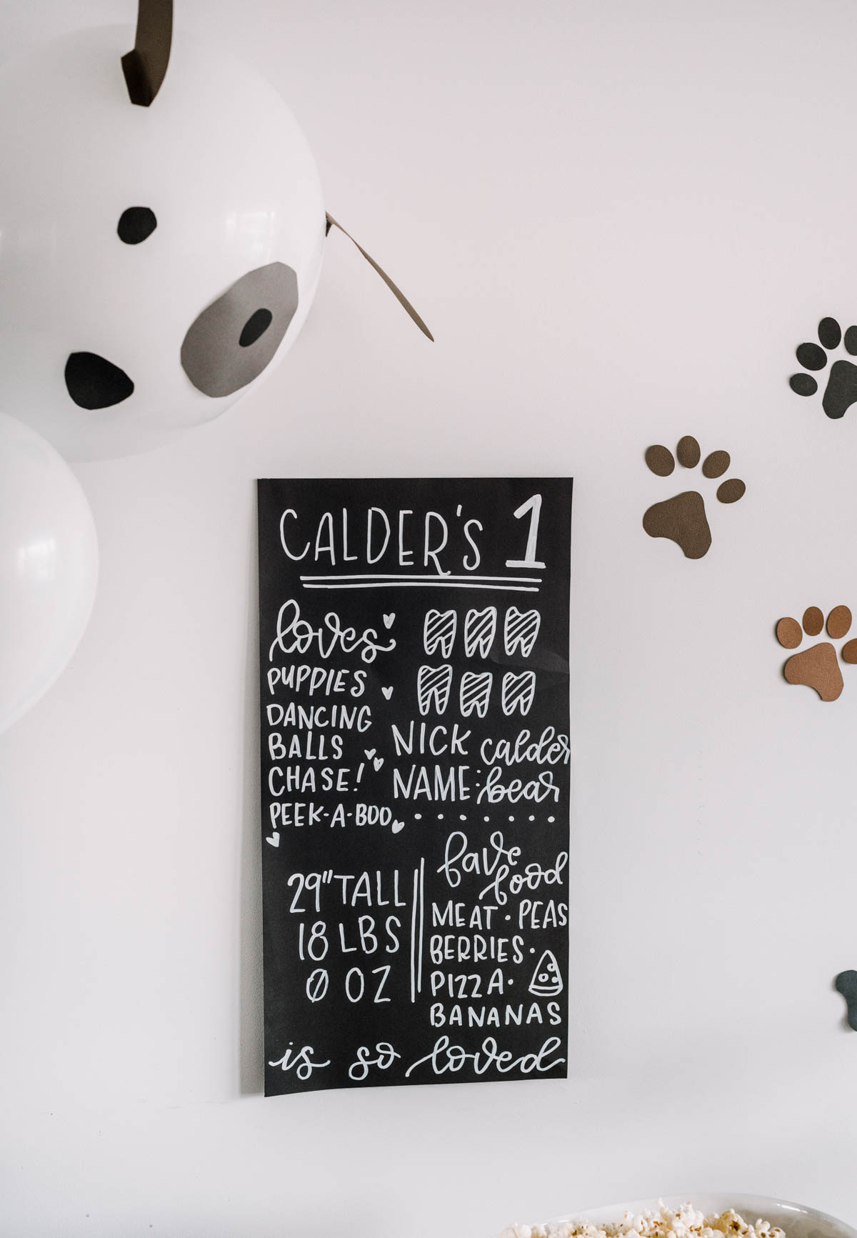 First birthday party stats poster made with poster board and paint marker