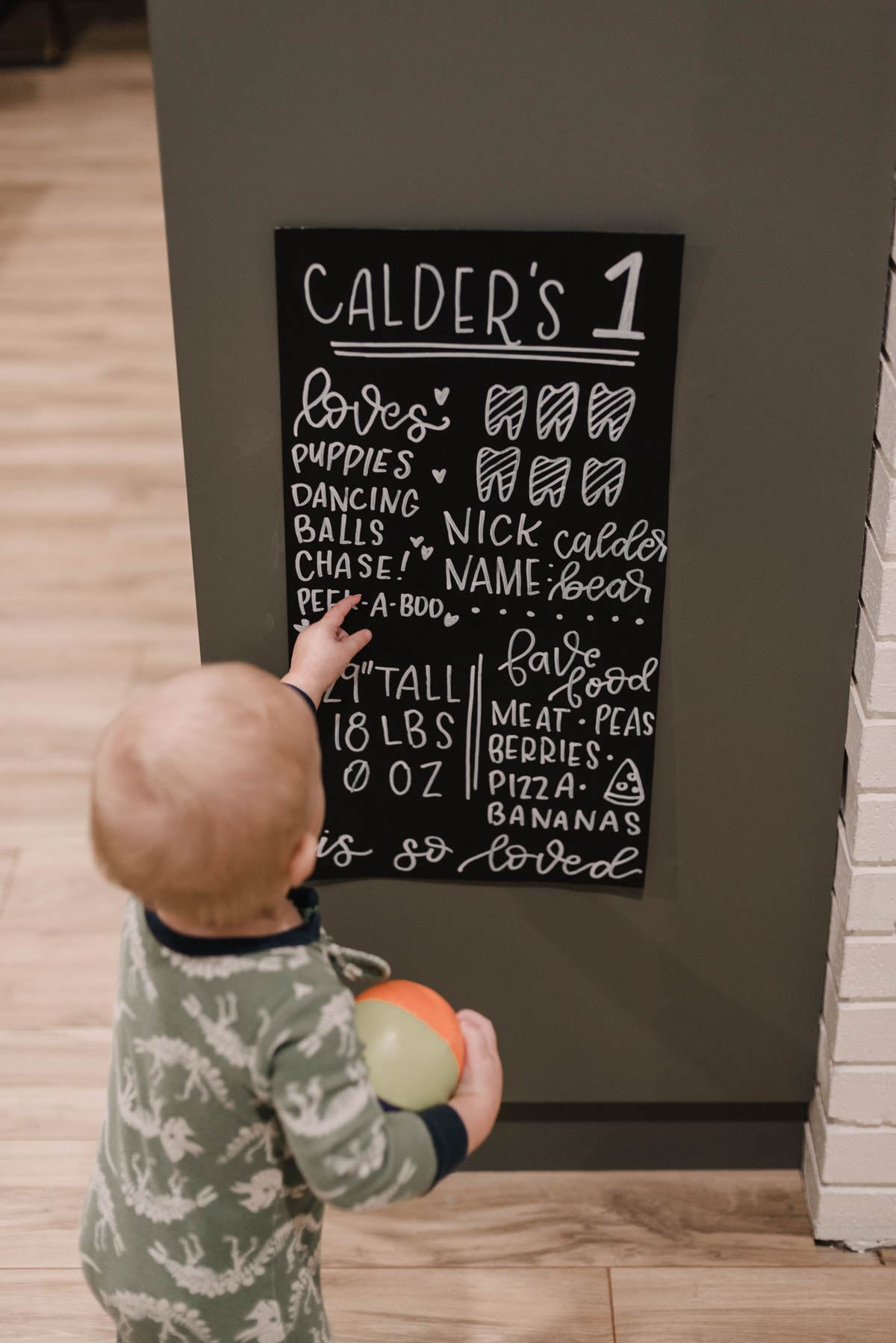 First birthday party stats poster made with poster board and paint marker