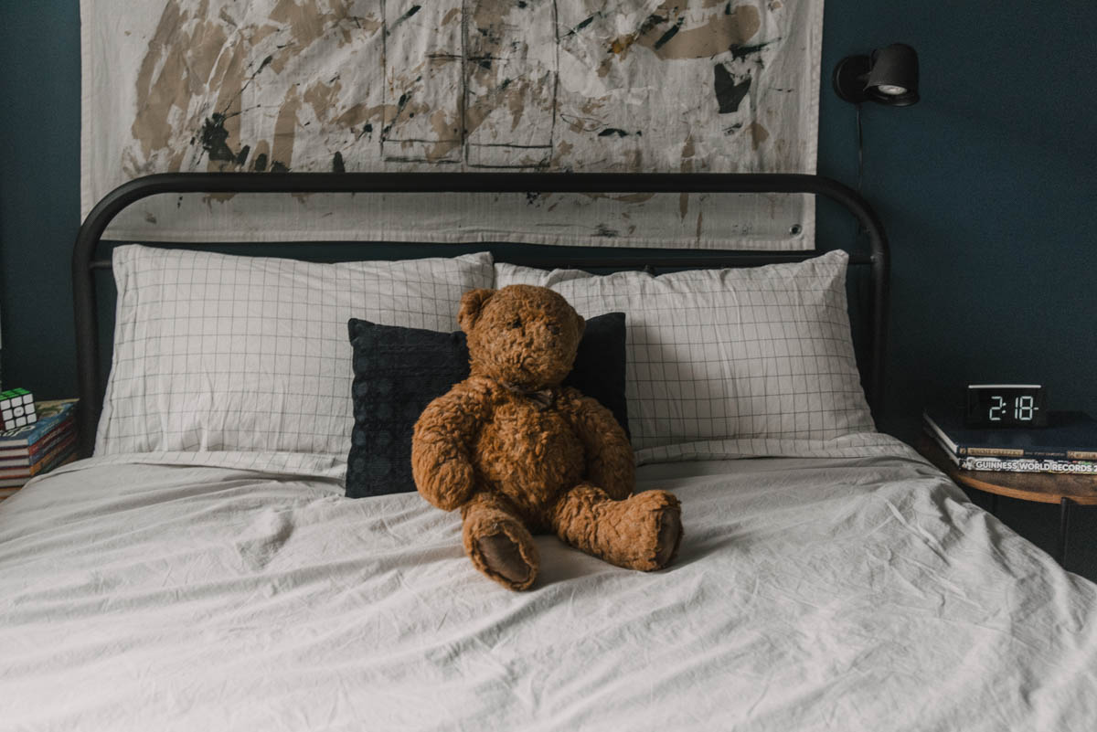 Tween bedroom with blue walls and neutral bedding
