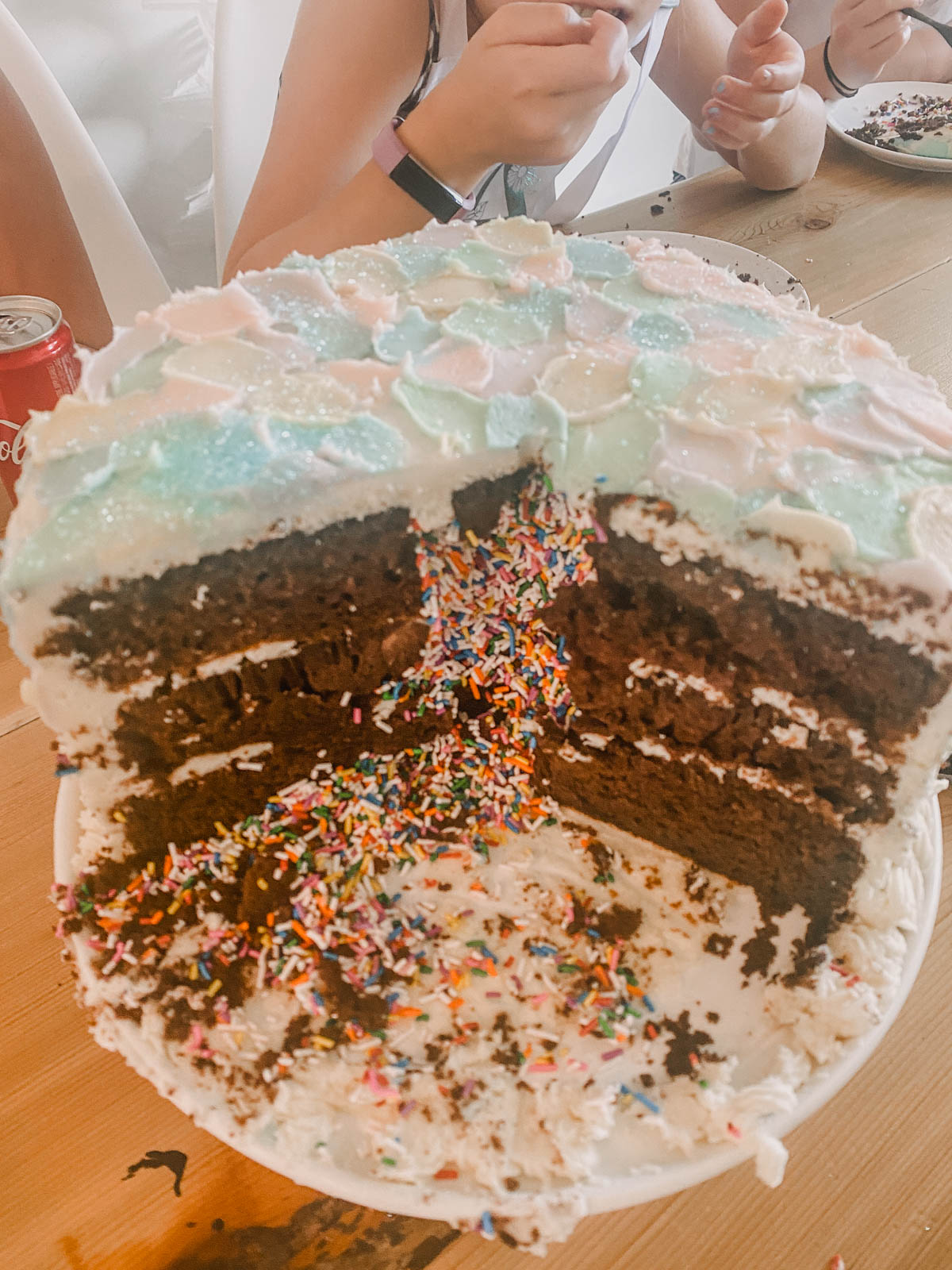 Modern pastel cake for a girls birthday party filled with sprinkles