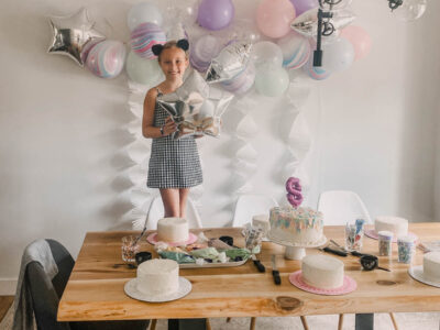 DIY Cake Decorating Party with pastel balloons and white fringe garlands