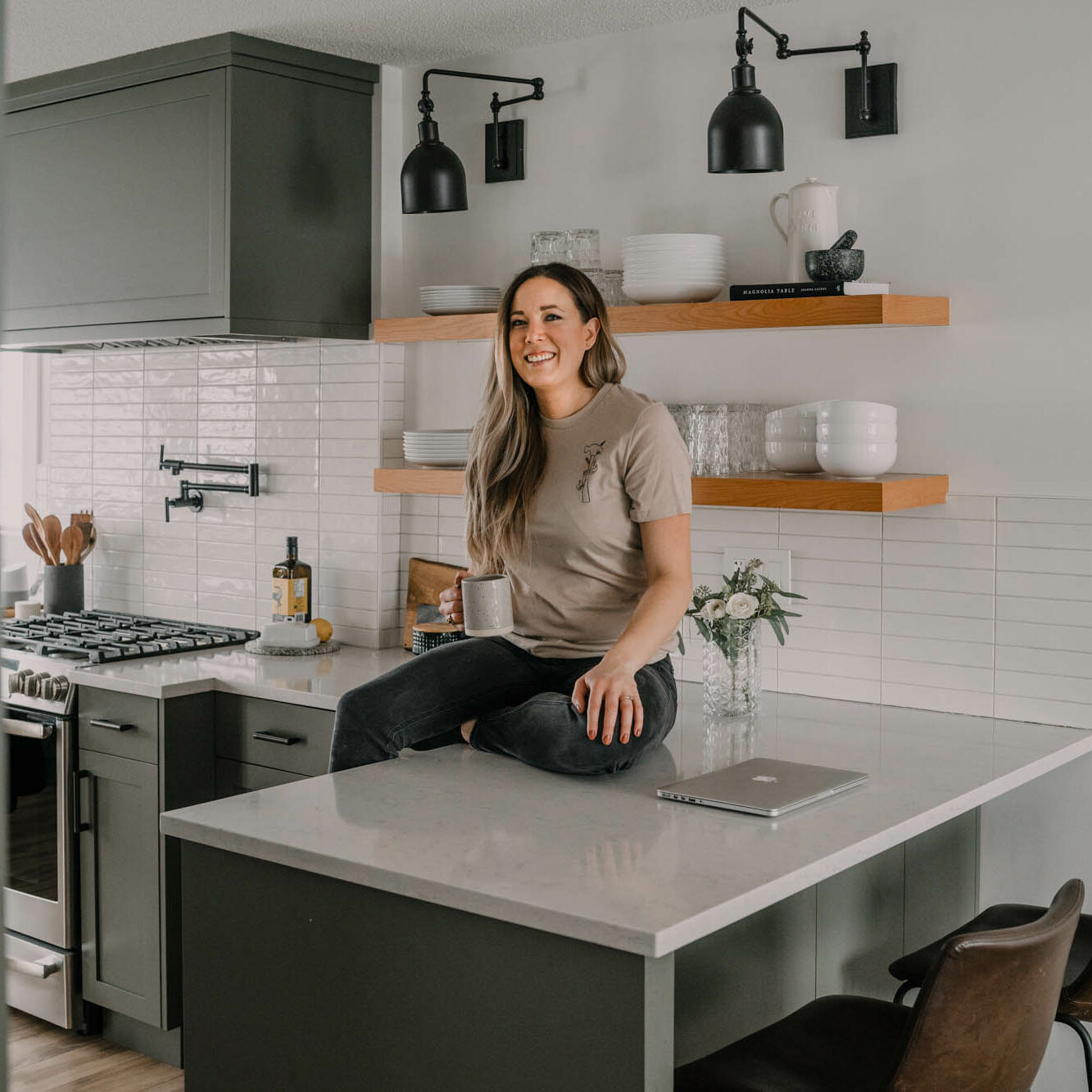colleen in her kitchen, sitting on counter
