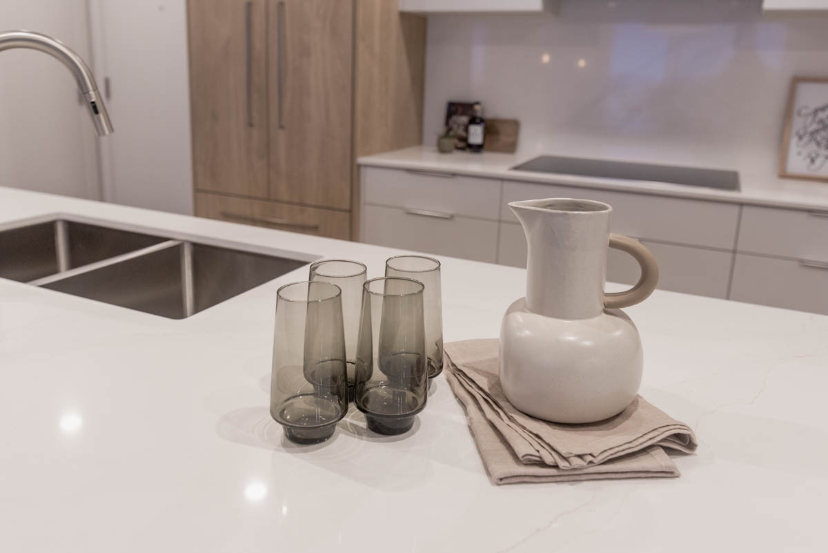 simple entertaining set up on counter for every day guests of water pitcher and glasses