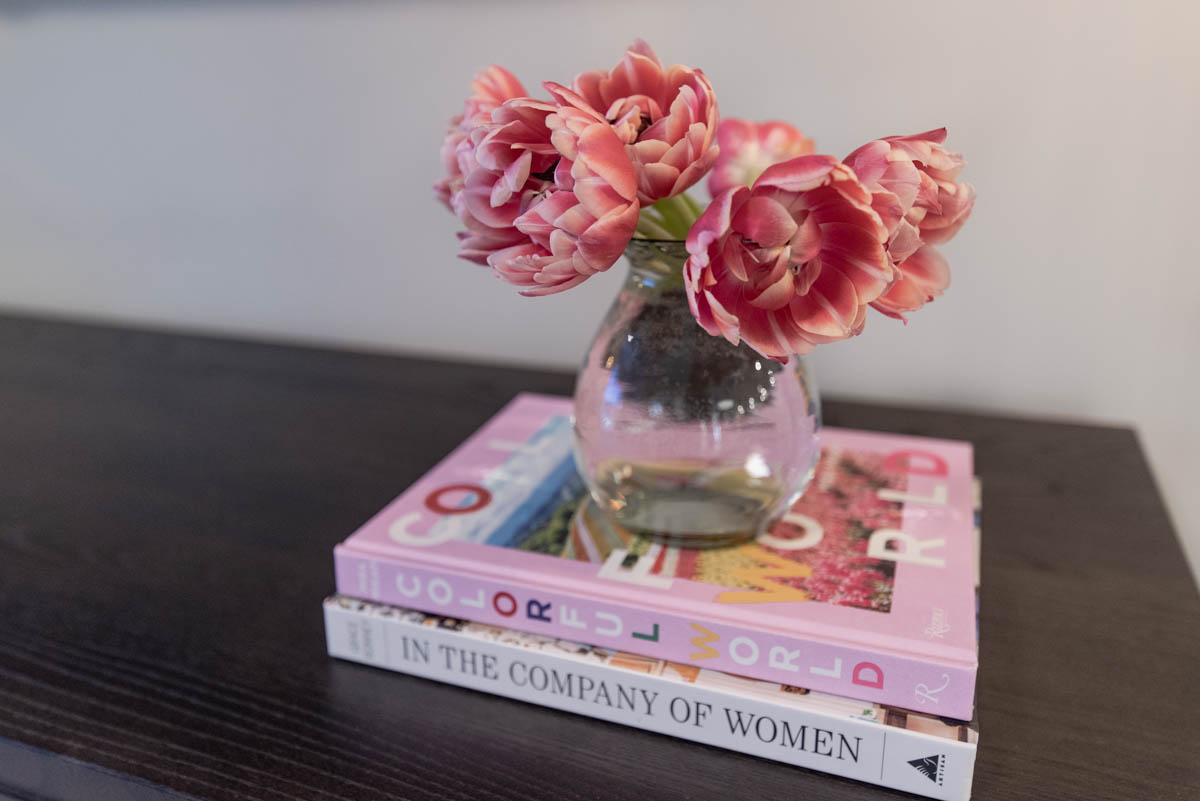 pink tulips on colorful books