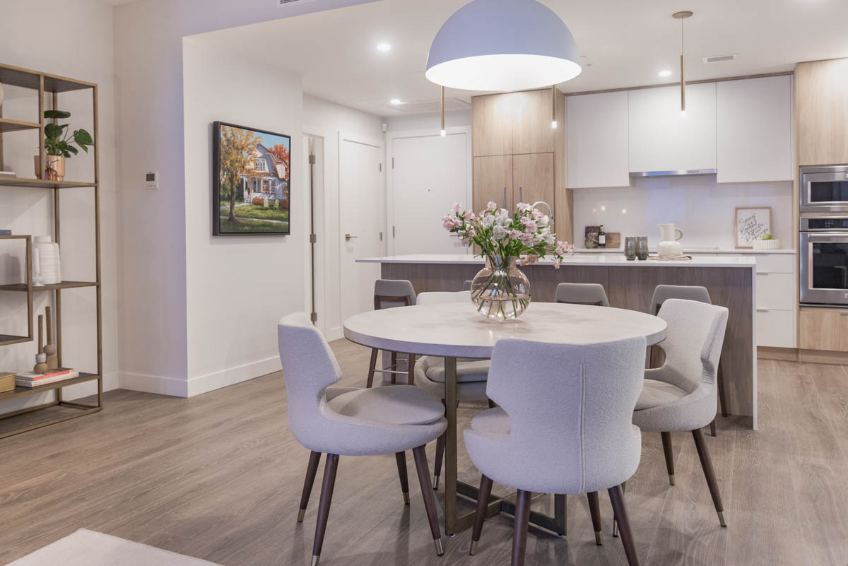 Simple spring decorating- flowers on top of round dining table in modern apartment