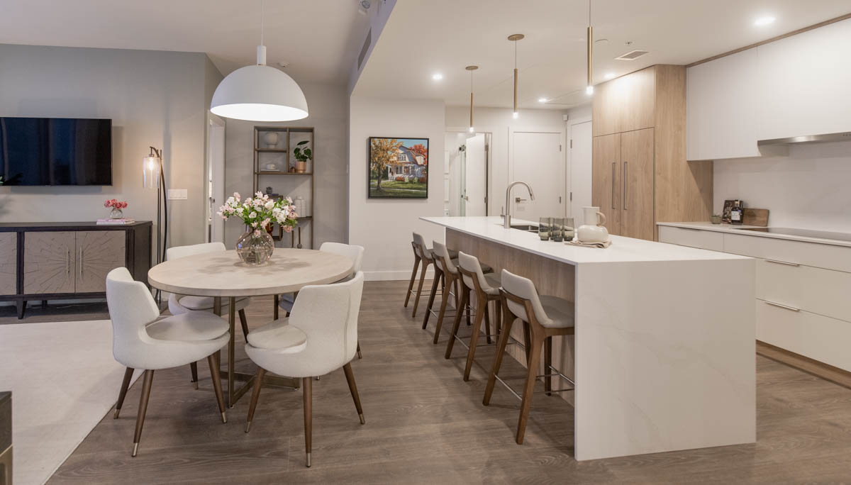 Spring Decorating with city gardens in kamloops- photo of open concept show apartment with light wood floors and kitchen