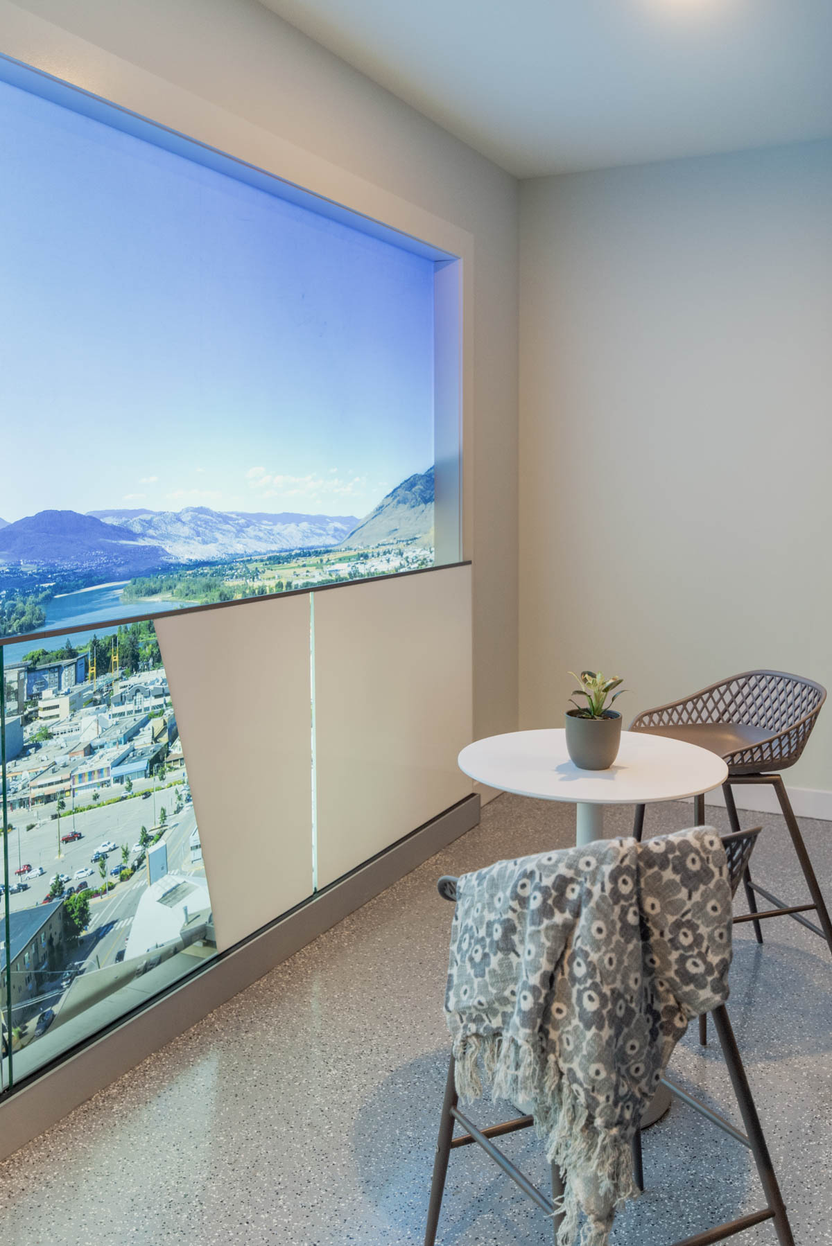 apartment patio ready for spring with floral blanket