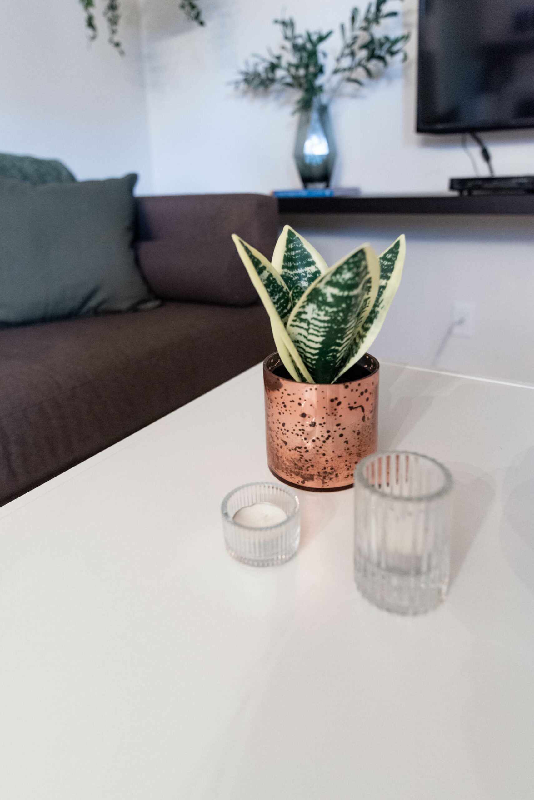 simple and minimal boho decor- tea light candle holders and faux plants