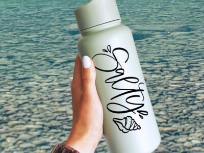 Salty! Hand Lettered SVG File on waterbottle in front of lake